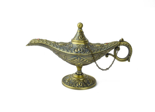 Antique Golden Colored Oil Lamp With Rust Displayed Over A White Background