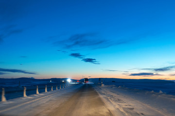 Fototapeta na wymiar Picturesque winter landscape of Iceland. The perfect road to perspective