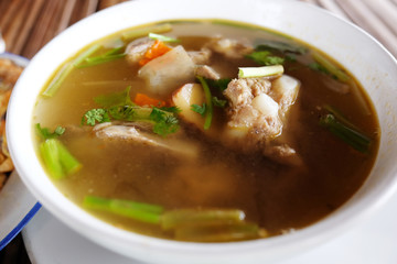 Thai food Pork spare rib Spicy soup in white bowl.