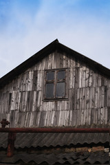 Fototapeta na wymiar Old shabby wooden window in a rustic house