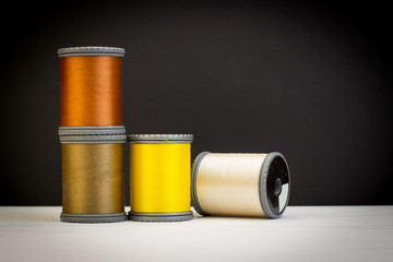 Group set of pastel color treads on black paper background