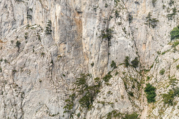 Spectacular view of the steep mountainside from the cab of the funicular. Cable car in the Crimean mountains, Ai-Petri. Nature stone texture. 