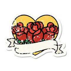 traditional distressed sticker tattoo of a heart and banner with flowers