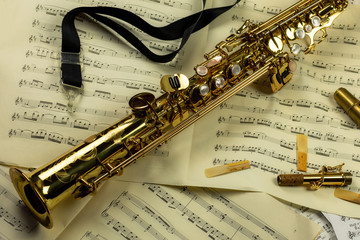 Soprano saxophone - background of musical notes