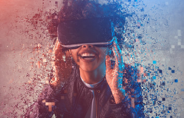 Cheerful black woman disintegrating during virtual reality exploration