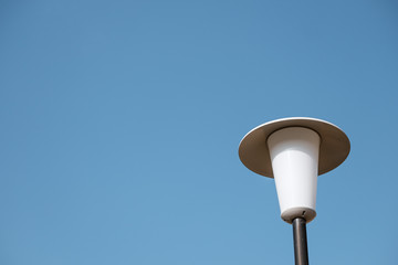 Street lamp with sky in the background