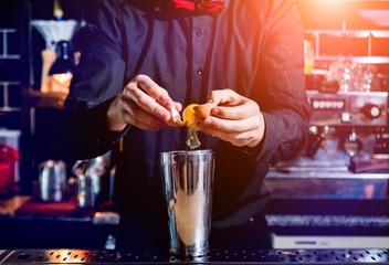 Bartender is making cocktail at bar counter. Fresh cocktails. 