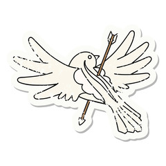 traditional distressed sticker tattoo of a dove pierced with arrow