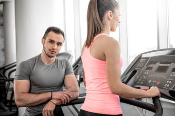 Treadmill walk with personal trainer.