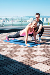 Push ups outdoor with personal trainer support