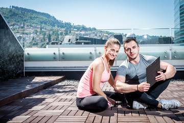 Personal trainer sitting with his client