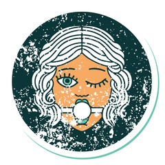 distressed sticker tattoo style icon of winking female face with ball gag