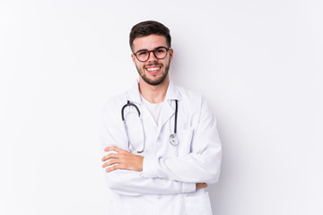 Young caucasian doctor man isolated laughing and having fun.