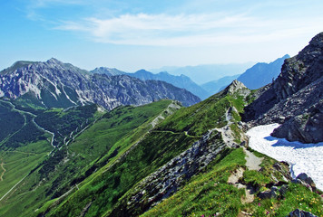 Alpine mountain peaks Spitz, Gamsgrat and Raucher Berg over the Malbuntal alpine valley and in the...
