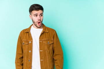 Young handsome man being shocked because of something she has seen.