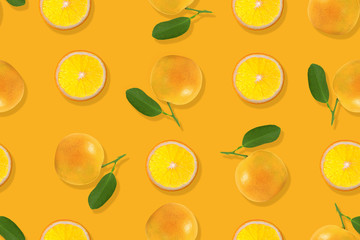Fruit pattern of fresh orange  on yellow background. Top view. Copy Space.