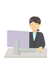 スーツを着たパソコンを使う女性