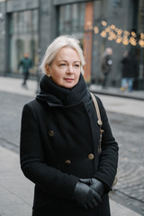 Fototapeta premium Portrait of senior woman on the street