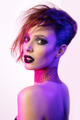 Colorful portrait of a sensual young woman in avant garde style