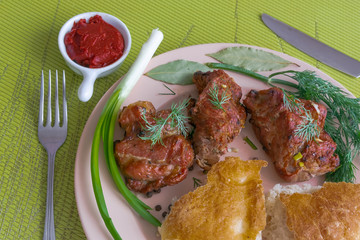 Plate with grilled meat skewers, bread and spices. Harmful and hazardous food containing carcinogens.