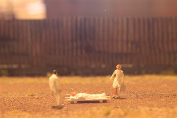 Simple Conceptual Photo, Mini Figure Doctor and Nurse Mini Figure Toy Evacuating corona virus suspect at empty land