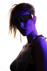 Colorful portrait of a young woman wearing futuristic glasses