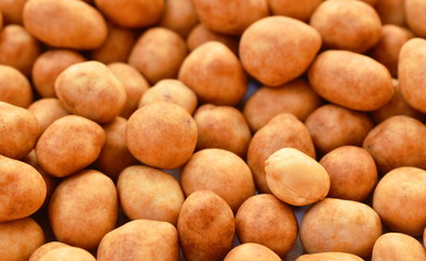 crispy sweet peanut coating coconut milk arranging on white background