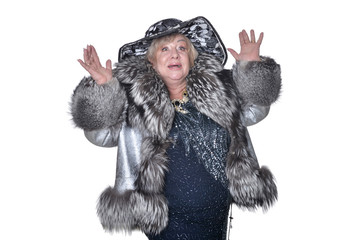 Portrait of senior woman wearing black hat and fur coat