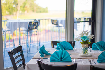 costal theme table and chairs in restaurant