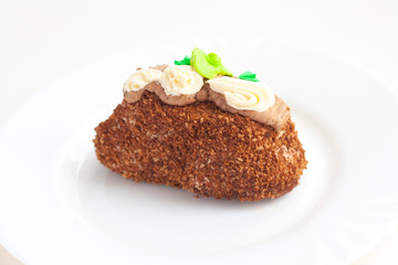 A piece of cake topped with cream