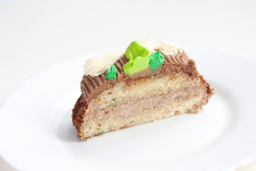 A piece of two-layer cake with cream