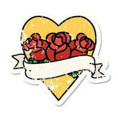 traditional distressed sticker tattoo of a heart and banner with flowers