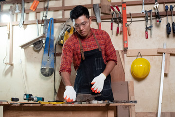 Handsome man doing wood work at factory,Handmade design,The carpenter