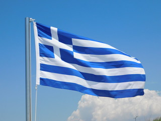 A blue and white Greek flag waiving in the wind