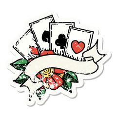 traditional distressed sticker tattoo of cards and banner