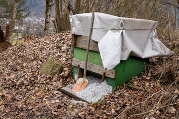 one box there is grit for the road in winter and next to it is a shovel
