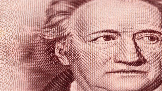 Johann Wolfgang von Goethe portrait on East German 20 mark (1964) banknote tracking. Slider shot. Low angle, macro. 4K