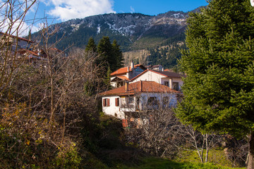 Fototapeta na wymiar View of traditional architecture of Agoriani or Eptalofos village, a winter destination near Parnassos mountain in Greece