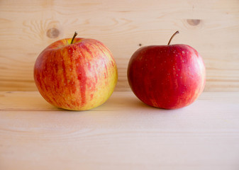red tasty Sicilian apples on the on the wooden background, top view. Healthy lifestyle, vitamins and Mediterranean diet.