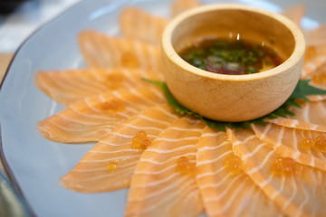 Thin fresh raw salmon