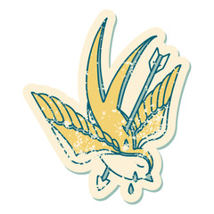 distressed sticker tattoo style icon of a swallow pierced by arrow