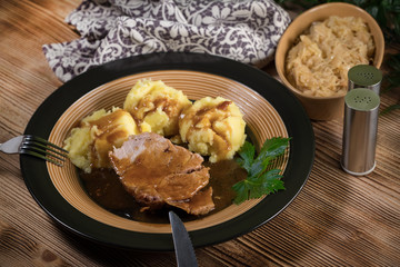 Braised pork neck in own sauce. Shallow depth of field.