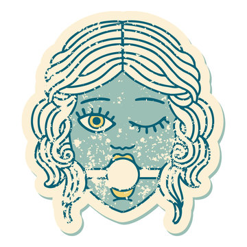 distressed sticker tattoo style icon of winking female face with ball gag