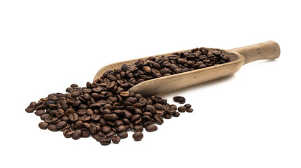 Roasted coffee beans on a large wood scoop in slanted view from front and isolated on white background