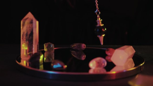 Extreme close up of fortune spelling on pendulum
