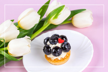 Tulip bouquet and mignon cake. Frame.