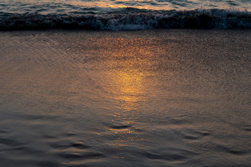 reflection sunset at the sand