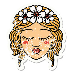 traditional distressed sticker tattoo of female face with eyes closed