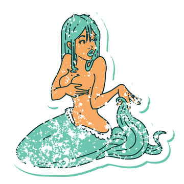 distressed sticker tattoo style icon  of a surprised mermaid
