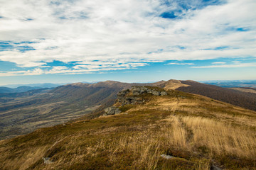 highland mountain ridge dirt trail touristic route for hiking in wilderness environment moody cloudy weather time in Carpathian mountains of Western Ukraine